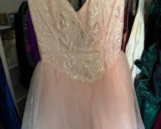 Blush pink strapless formal gown with brocade bodice and tulle skirt
