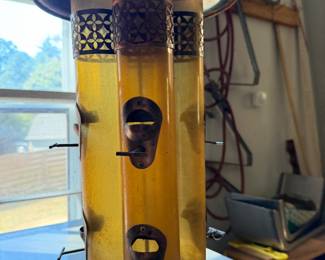 Tube style hanging bird feeder with multiple seed chambers and perches