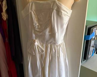 Ivory satin spaghetti strap dress with bow at the waist