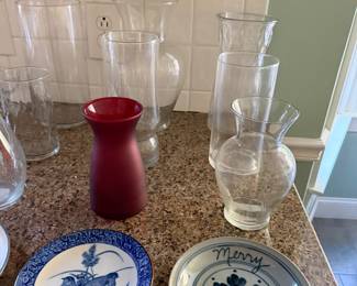 Hurricane glass vases, a red ceramic vase, a blue and white quail plate and a hand painted Merry Christmas plate