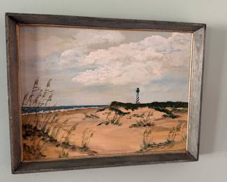 Framed oil painting of a beach dune scene with the Cape Hatteras lighthouse