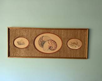 Long gilt framed panel with three relief shell medallions including a nautilus
