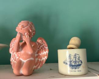 Pink ceramic cherub figurine and a sailing ship shaving mug with brush