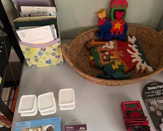 Madeline tea set, basket of painted wood Christmas decorations, digital multimeter, cup hooks and LED tea lights