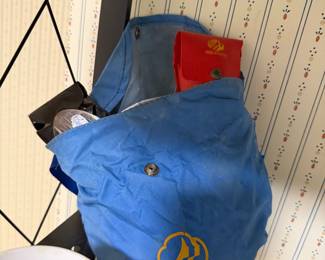 Vintage Girl Scouts blue duffel bag with a Girl Scouts handbook