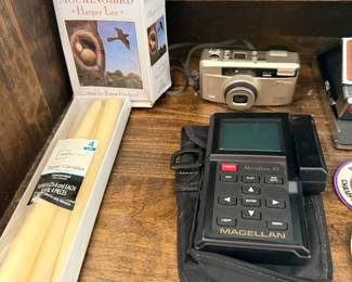 To Kill a Mockingbird audiobook set, boxed taper candles, a compact camera and the Magellan GPS
