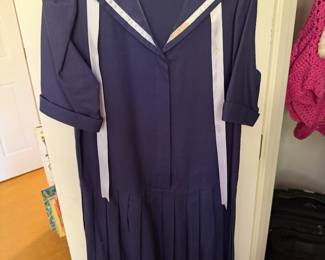 Vintage navy sailor dress with white trim and pleated skirt