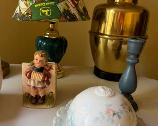 John Deere shade lamp, brass lamp, accordion player figurine and floral domed butter dish