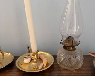 Brass chamberstick, pressed glass oil lamp with chimney and a small ceramic shell dish