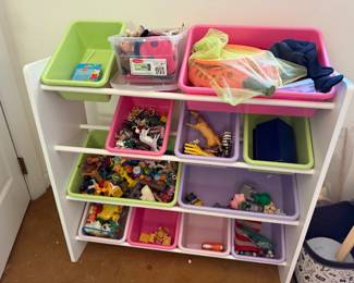 Toy organizer with bins of small toys, animal figures and blocks