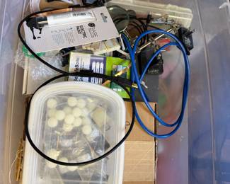 Bin of electrical and craft supplies including cables, clamps and cabinet knobs