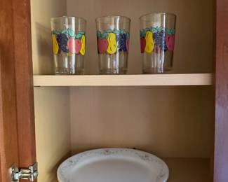 Three fruit decorated drinking glasses and a floral china platter