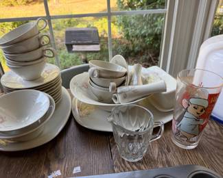 Floral china set with cups, saucers, bowls and platters, a cut glass creamer and a character tumbler