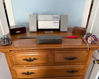 Dresser with Panasonic stereo, silverplate and carved wood boxes and drawstring pouches