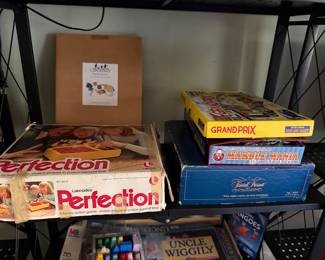 Vintage board games including Perfection, Grand Prix, Marble Mania and Trivial Pursuit