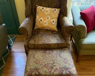 Paisley upholstered wingback chair with matching ottoman