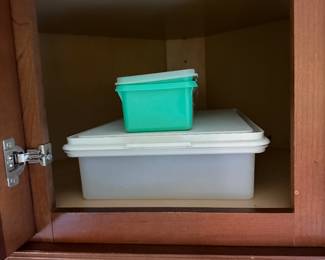 Cabinet with two lidded plastic storage containers