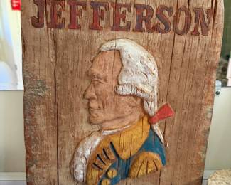 Carved and painted wood Jefferson Hotel trade sign with a relief portrait