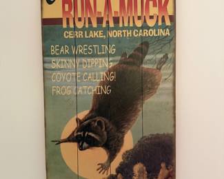 Rustic wood plank Camp Run-A-Muck Kerr Lake North Carolina sign with a raccoon