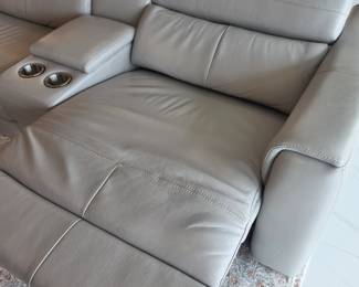 Leather sectional sofa. There are three of the seats that are recliners