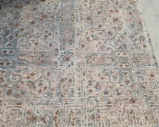 This area rug measures 7'10" by 10'