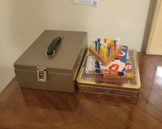 Lot 144: Metal Lock Box and Assorted Games
