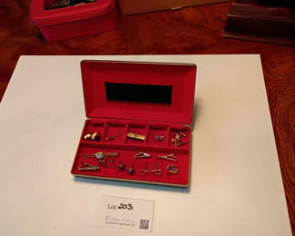Lot 203: Assorted Cufflinks and Tie Clips in Display Case