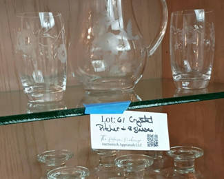 Lot 61: Glass Pitcher, Two Drinking Glasses, and Five Glass Candle Holders