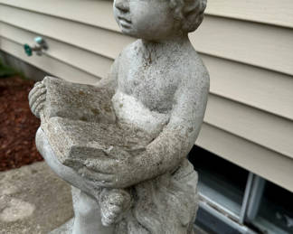 Lot 248: Child Figurine Holding an Open Book
