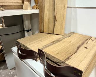 Wide variety of handmade cutting boards with leather handles
