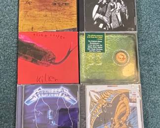 Alice Cooper, Metallica, and Iron Butterfly CDs