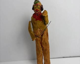 236 vintagewindupclowntinandclothtoy