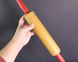 083 vintagewoodenrollingpinwithredhand