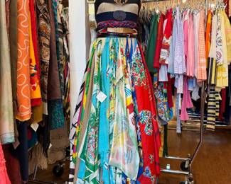 Vintage scarfs, belts, hats and mannequin.