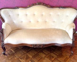 French Louis XV Style Carved Walnut Tufted Settee with Floral Crest