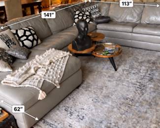 Too grain leather sectional in a light grey $1200