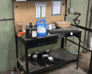 Lot 416: Industrial Workbench with Pegboard and Automotive Fluids