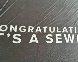 Lot 82: Black Fabric Banner with "Congratulations It's a Sewell" Text