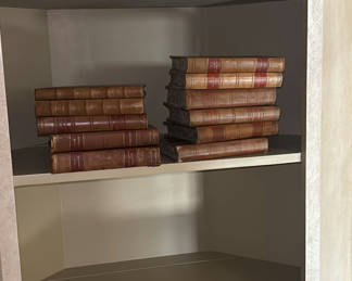 Lot 122: Decorative Leather-Bound Books and Framed Wall Mirror