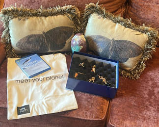 Lot 24: Decorative Pillows, Ceramic Vase, Miniature Figurines, Frozen Planet Blu-ray Set, and Tote Bag