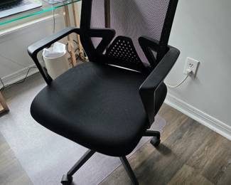 Black mesh high-back office chair with padded seat and armrests