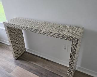 Waterfall console table with gray and white scale-pattern inlay
