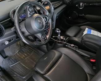 MINI Cooper interior with black leather-look seats and manual shifter