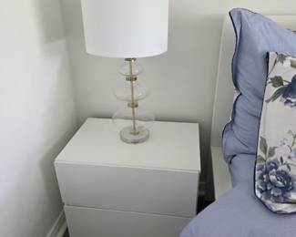 Matching white two-drawer nightstand with glass gourd lamp