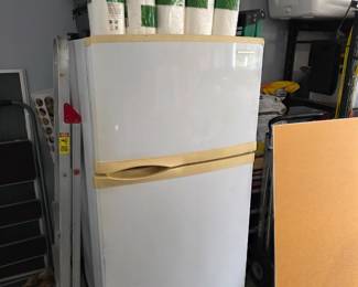 White top-freezer refrigerator with almond handle trim