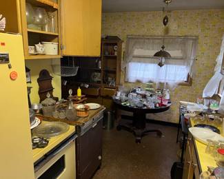 Vintage appliances and lots of vintage dishes