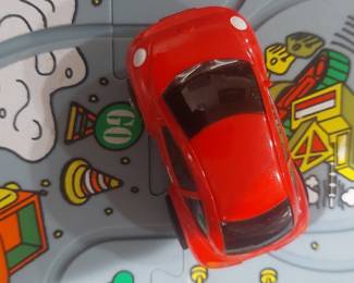 Assorted Plastic Toy Cars and Interlocking Track Tiles
