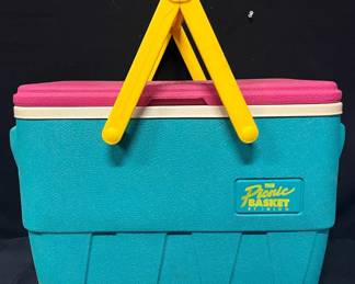 Vintage Igloo “The Picnic Basket” 25-Quart Cooler Great retro color combination on this vintage Igloo Picnic Basket cooler, with turquoise body, hot pink lid and yellow folding handles. The original hang tag identifies it as a 25 U.S. quart / 23.7 liter Legend Ice Chest.  Approx. 18.5"L x 11"W x 13.5"H Removable interior tray Original hang tag included Interior has been wiped down Exterior needs additional cleaning Please see photos for condition Market Insight & Estimated Market Value: The bold retro colors and classic Igloo styling give this one appeal beyond everyday cooler use—great for picnics, camping, tailgating or a vintage outdoor collection.  Estimated Market Value: $40–$70