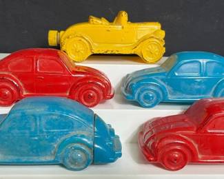 5 Vintage Multi-Colored Avon Car Decanters Please see pictures for approx measurements and condition of items 2 blue VW Bugs 2 red VW Bugs 1 yellow model A car Top coat seems to be peeling off due to vintage age
