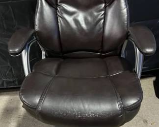 Rolling Office Chair Dark brown, faux leather, rolling office chair Chair measures 27”x30”x47” tall with a 21”x21” seat Seat height is adjustable Has all of its wheels Has some places where the leather is wearing away See pictures for details